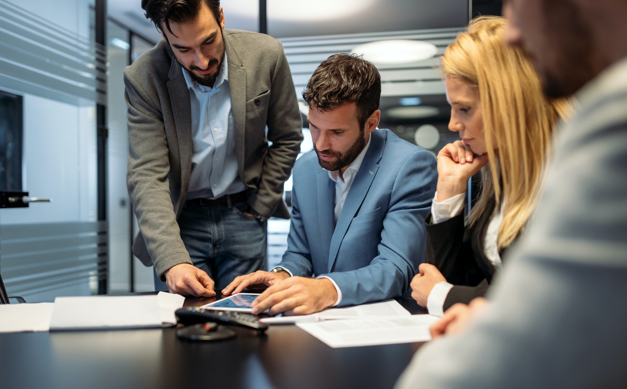 Business owner meeting with advisors to negotiate business debt